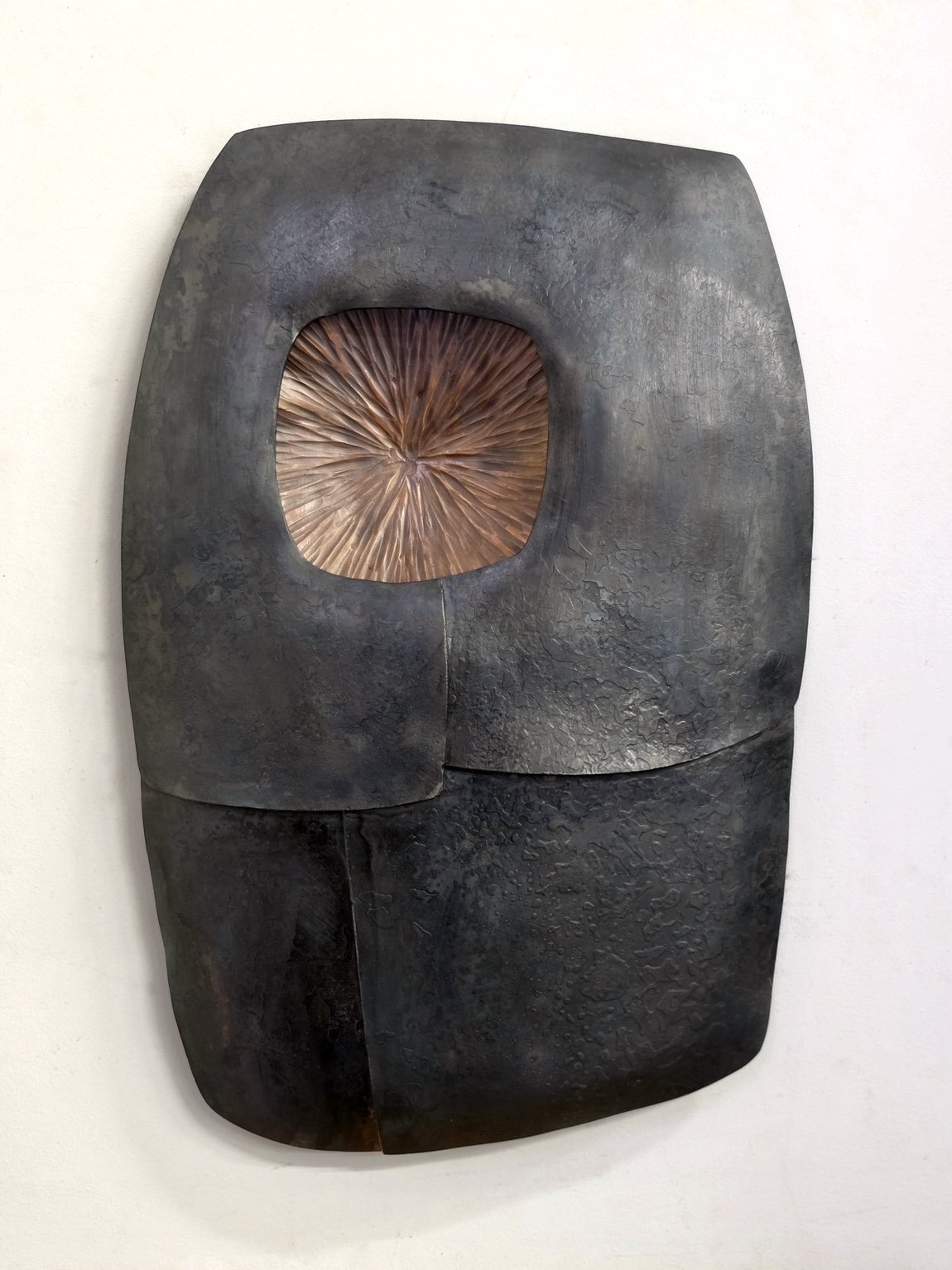 Inner Flame by Maria Cristalli — steel panels with bronze center